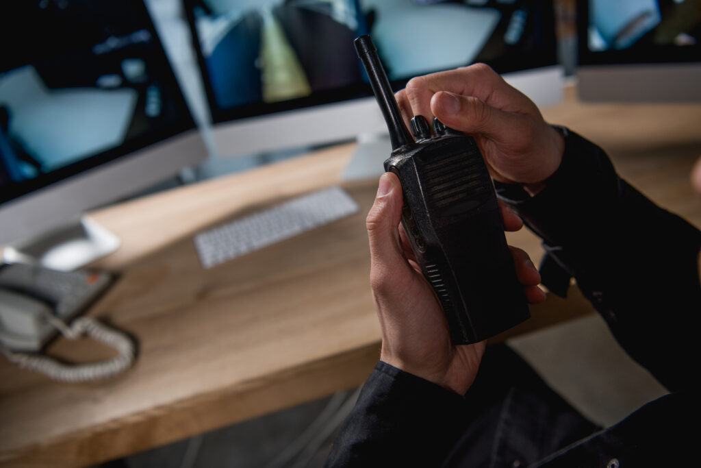 cropped view of guard holding walkie talkie at wor 2021 09 03 16 43 21 utc 1024x683 - About